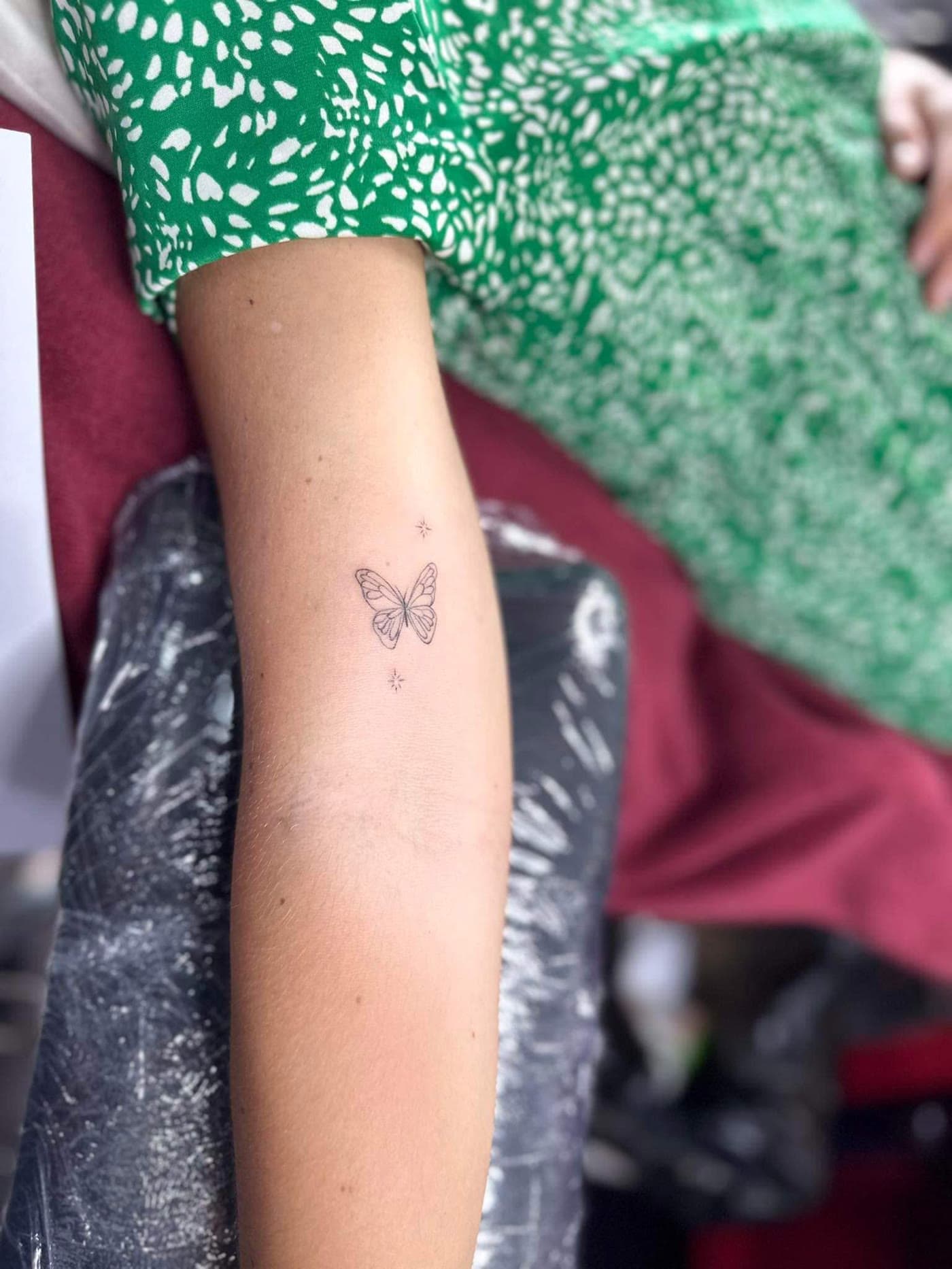 Small fine line butterfly tattoo